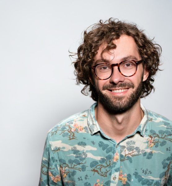 smiling man with glasses and beard portrait
