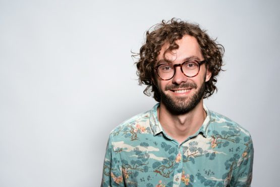 smiling man with glasses and beard portrait