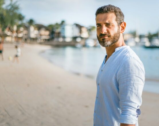 man standing on beach during daytime
