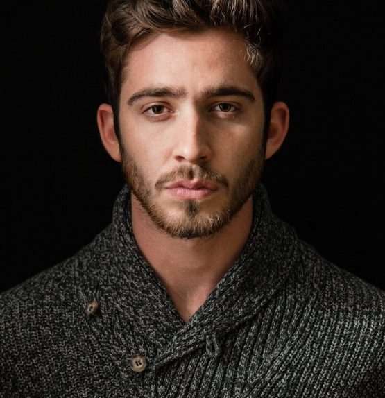 Photo by Albert Dera man's grey and black shirt