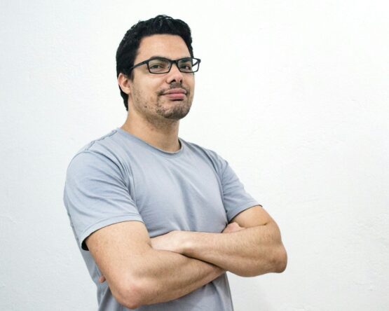 man crossing both arms