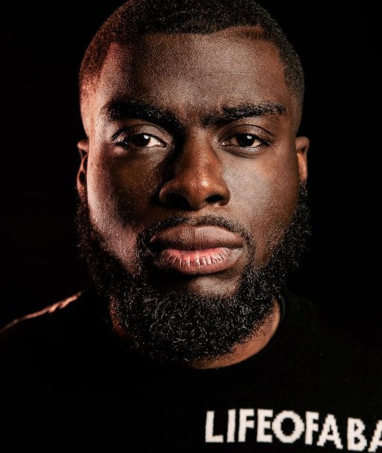 Photo by Jassir Jonis man in black crew neck shirt