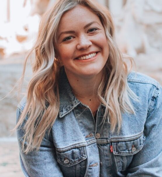 woman smiling wearing denim jacket